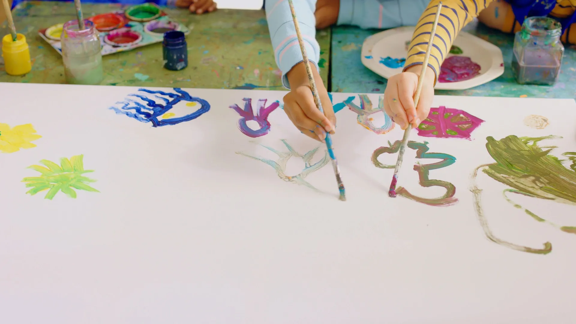 A young child learning through a music and creative activity
